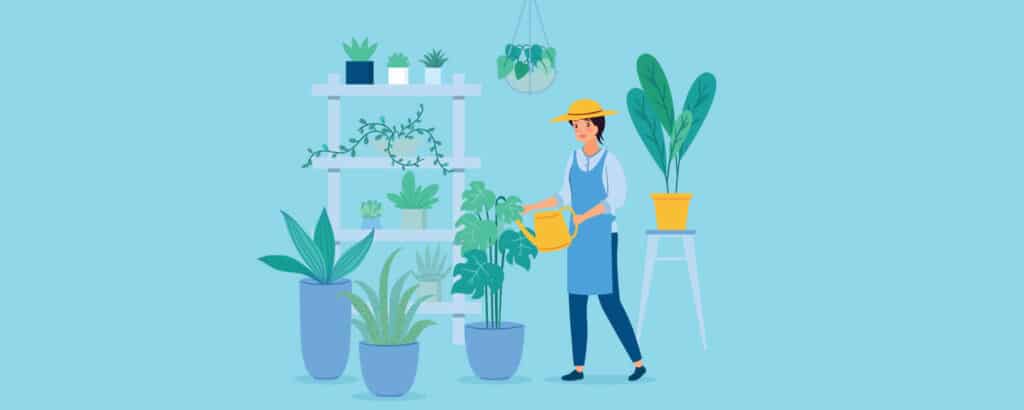 Woman watering her vegetable garden