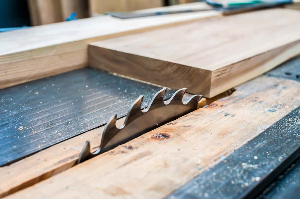 board on a stationary circular saw in a carpentry workshop. sawing wood. saw blade close up facts if can i use a smaller blade on my circular saw