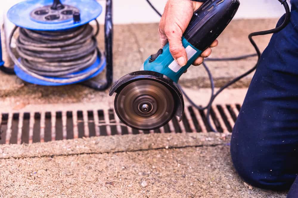 Radial saw operated by an operator, on a construction site. do you know what is a radial arm saw used for